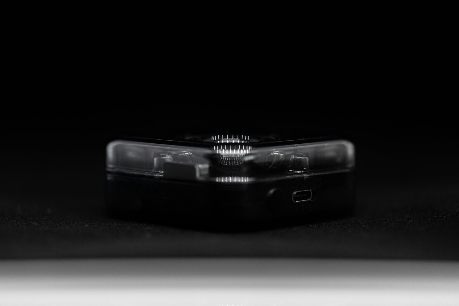 a black rectangular object with a light on it